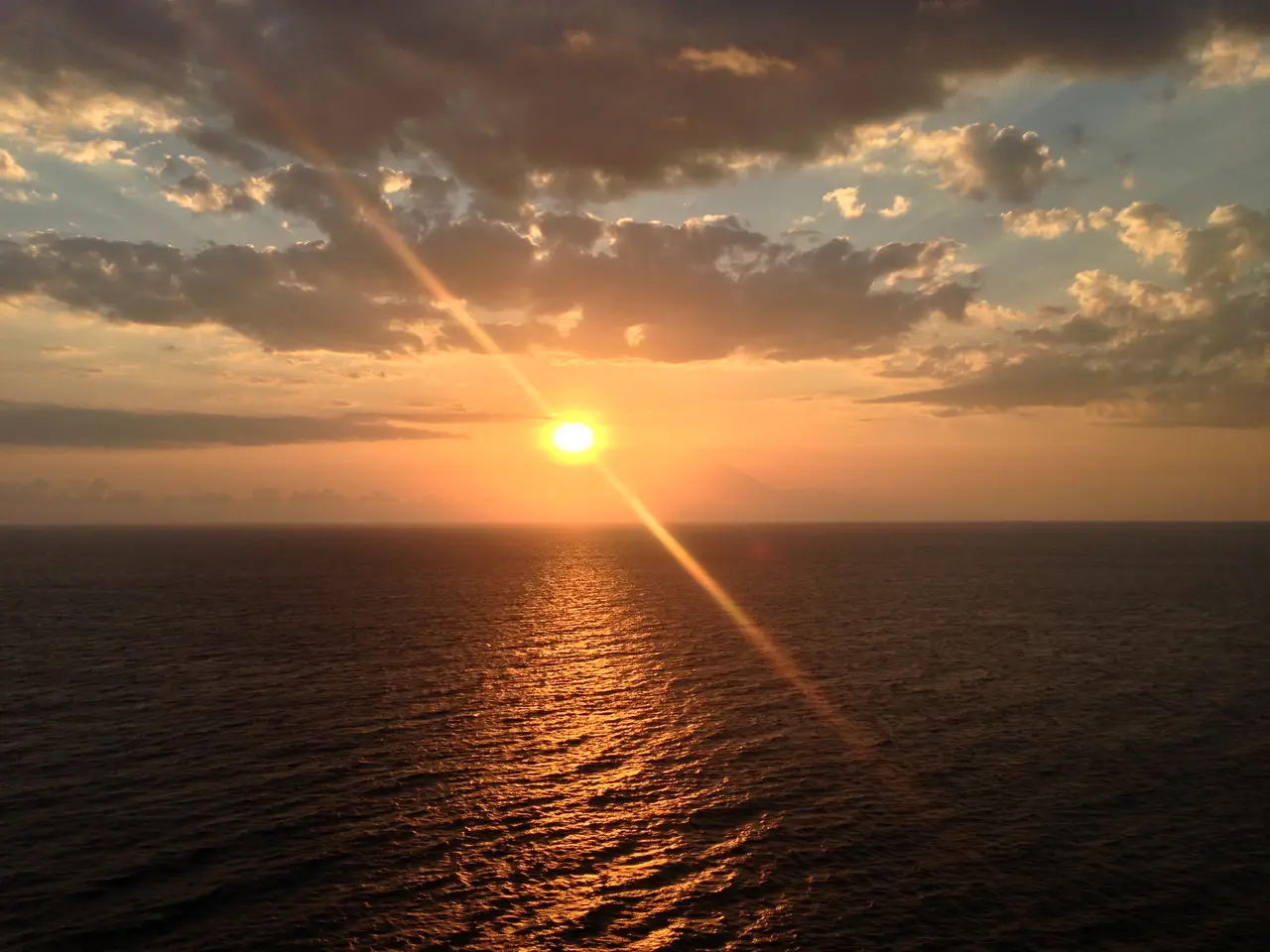 The sun setting over the sea at Malimbu