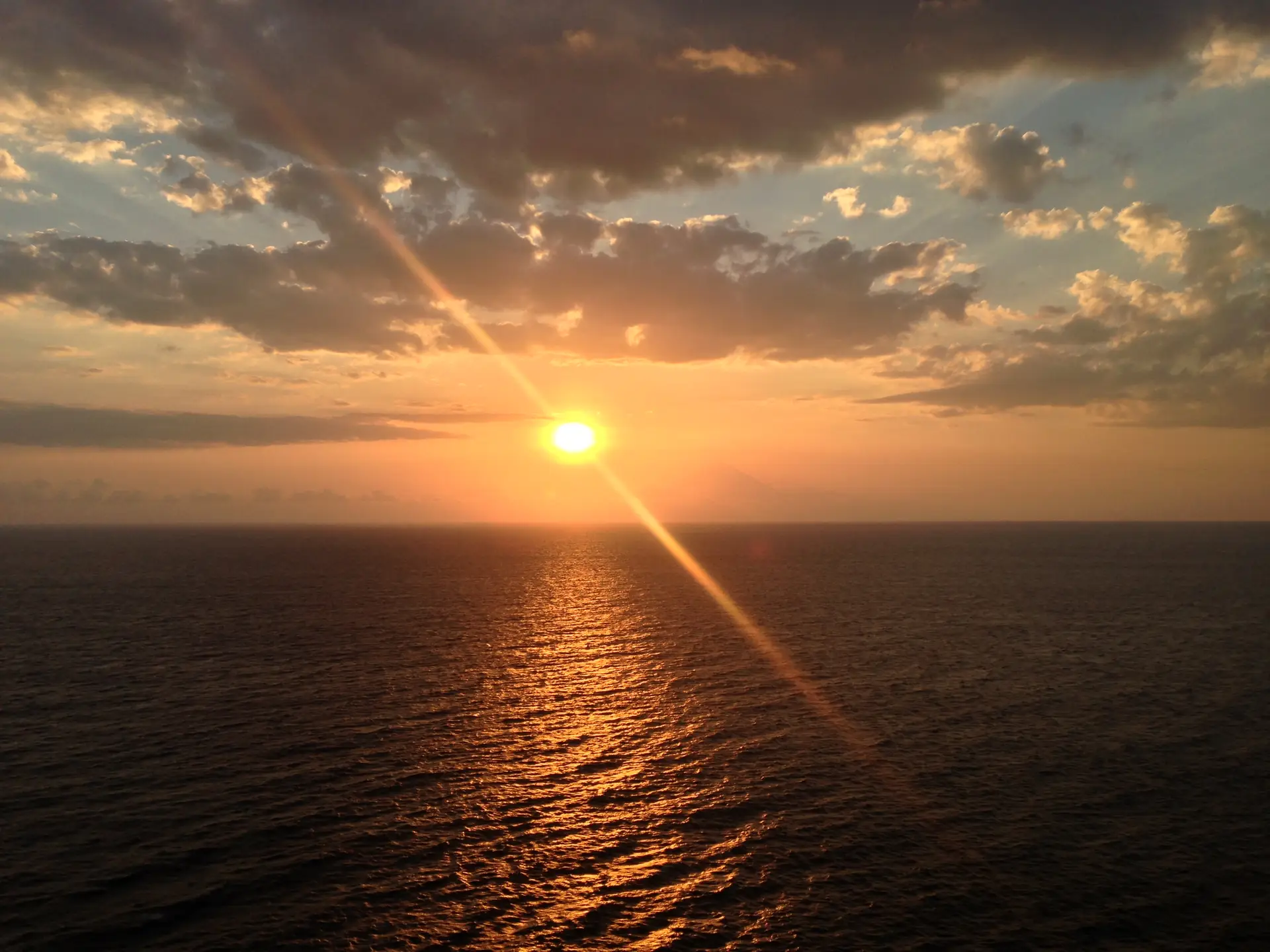 The sun setting over the sea at Malimbu